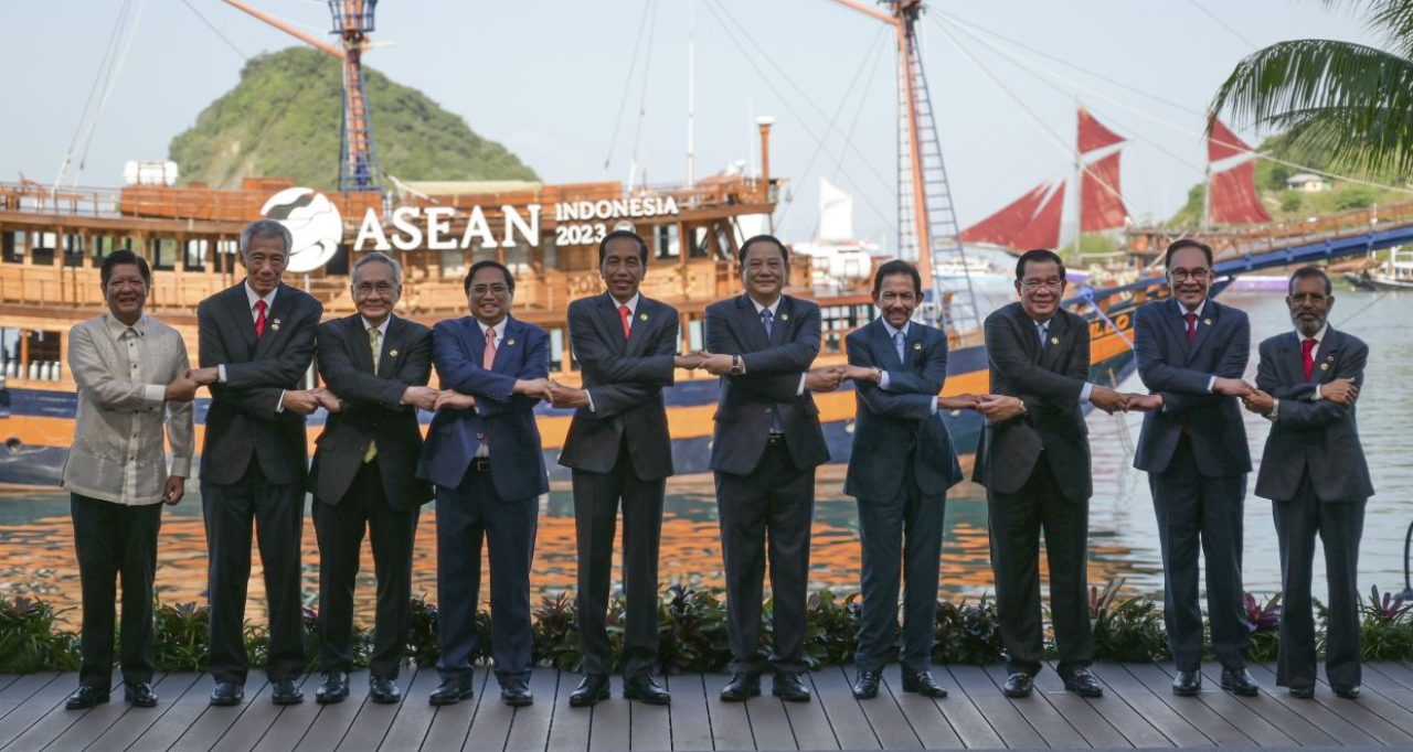 From left to right, Philippine President Ferdinand Marcos Jr., Singapore's Prime Minister Lee Hsien Loong, Thailand's Deputy Prime Minister and Foreign Minister Don Pramudwinai, Vietnam's Prime Minister Pham Minh Chinh, Indonesian President Joko Widodo, Laotian Prime Minister Sonexay Siphandone, Brunei's Sultan Hassanal Bolkiah, Cambodia's Prime Minister Hun Sen, Malaysian Prime Minister Anwar Ibrahim and East Timorese Prime Minister Taur Matan Ruak hold hands for a family photo during the 42nd ASEAN Summit in Labuan Bajo, East Nusa Tenggara, Indonesia, Wednesday, May 10, 2023. (Bay Ismoyo/Pool Photo via AP)
